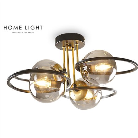 Luster jedinstvenog dizajna u kombinaciji crne i mesing boje sa 4 sijalična grla smeštenih u kuglama od dimljenog stakla.